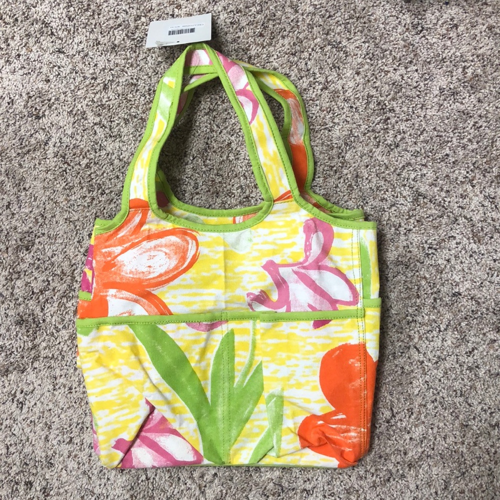 NWT adorable tote w/waterproof. Large pockets